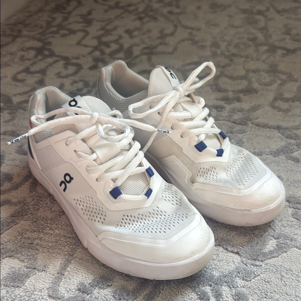 On Running White and Blue Athletic Shoes
